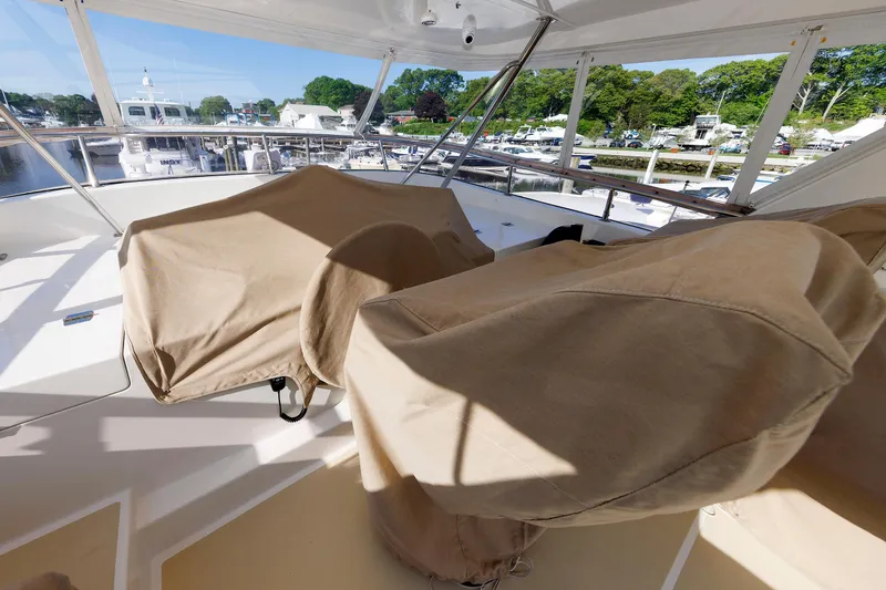 Slide: The Image of Covered seating area on 2007 Grand Banks 59 Aleutian RP yacht, docked at marina. - 84