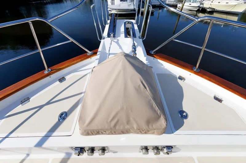 Slide: The Image of Bow deck of 2007 Grand Banks 59 Aleutian RP yacht with covered equipment. - 86