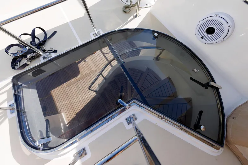 Slide: The Image of Glass hatch and spiral staircase on 2007 Grand Banks 59 Aleutian RP yacht. - 89