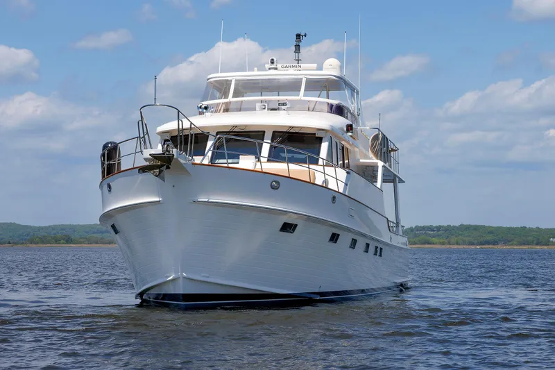 Slide: The Image of 2007 Grand Banks 59 Aleutian RP yacht on calm water under a blue sky. - 93