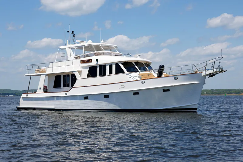 Slide: The Image of 2007 Grand Banks 59 Aleutian RP yacht cruising on a calm, sunny day. - 96