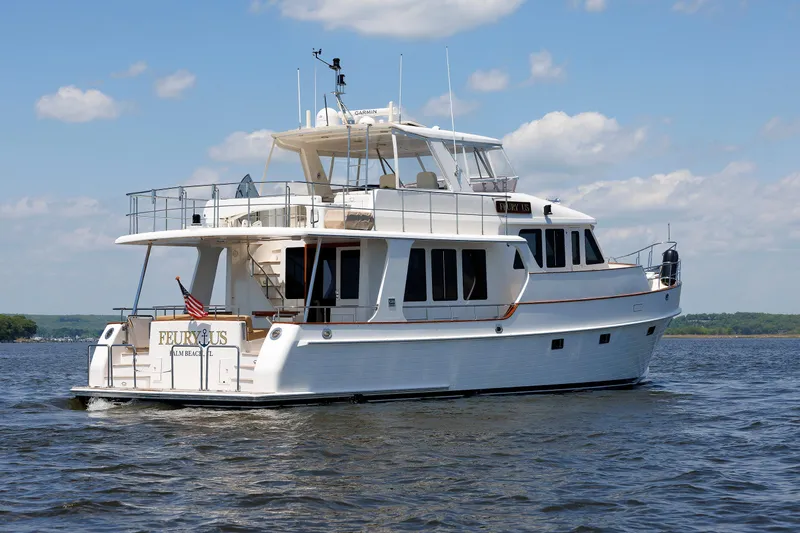 Slide: The Image of 2007 Grand Banks 59 Aleutian RP yacht cruising on a sunny day. - 98