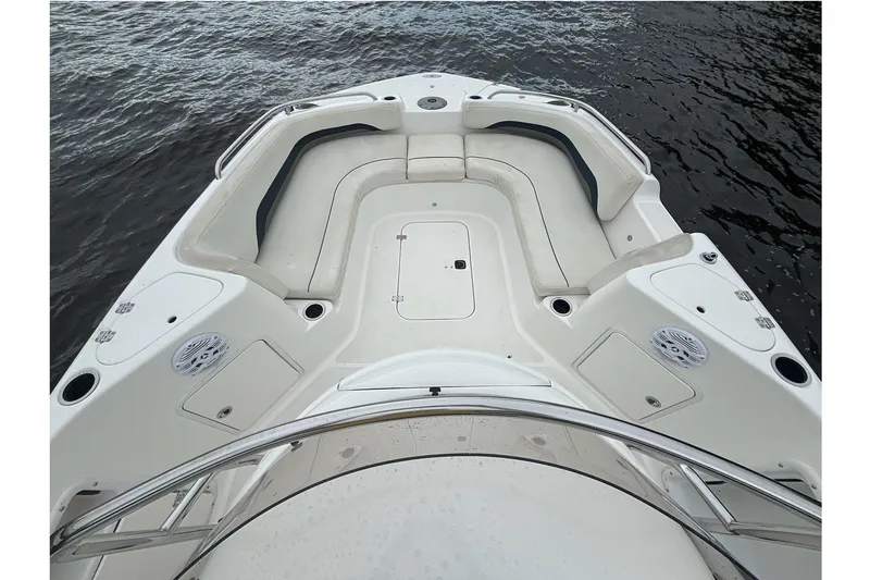Slide: The Image of 2015 Hurricane SunDeck Sport 231 OB boat interior with spacious seating and storage compartments. - 6