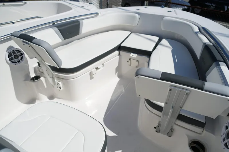 Slide: The Image of 2025 Robalo R200 Center Console boat interior with cushioned seating and speaker. - 11