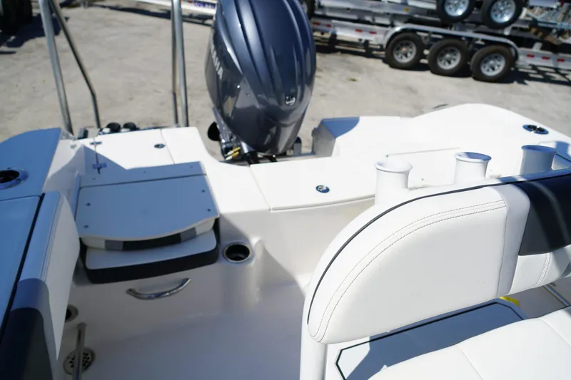 Slide: The Image of 2025 Robalo R200 Center Console boat interior with engine and seating. - 15