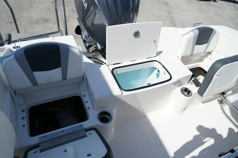 Slide: The Image of 2025 Robalo R200 Center Console boat interior with seating and storage compartments. - 17