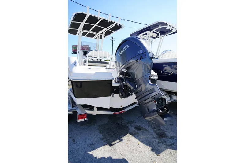 Slide: The Image of 2025 Robalo R200 Center Console boat with Yamaha outboard motor, parked on trailer. - 6