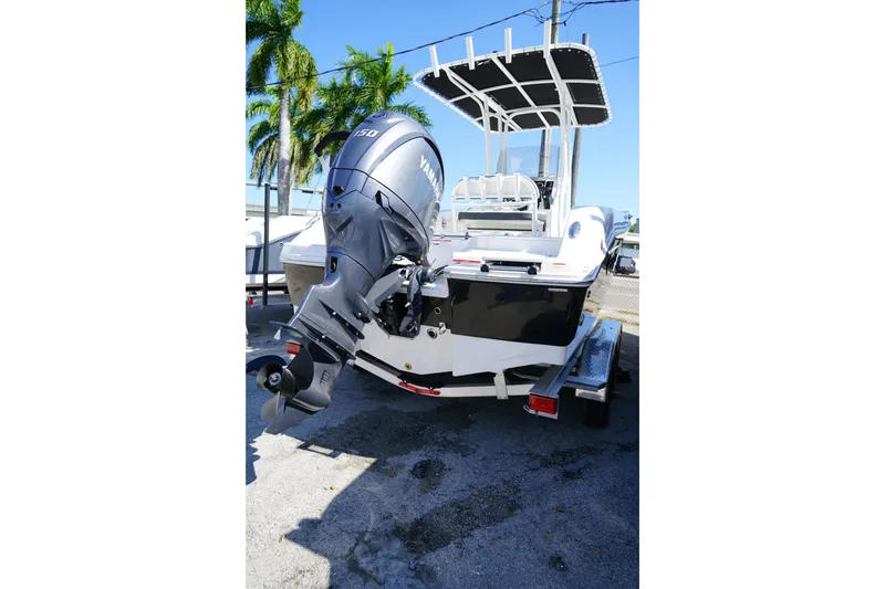 Slide: The Image of 2025 Robalo R200 Center Console boat with Yamaha outboard motor, parked on trailer. - 7