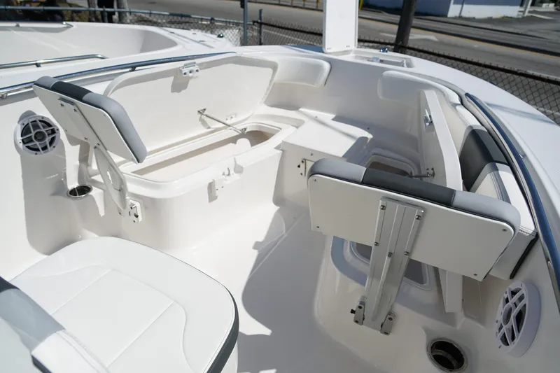 Slide: The Image of 2025 Robalo R200 Center Console boat interior with seating and storage compartments. - 8