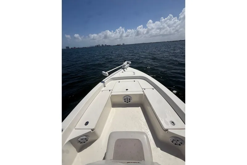 Slide: The Image of 2012 Pathfinder 2200 TRS boat on open water under a clear sky. - 16