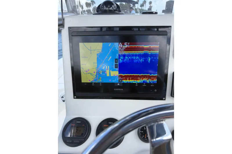 Slide: The Image of Garmin navigation display on 2012 Pathfinder 2200 TRS boat dashboard. - 17