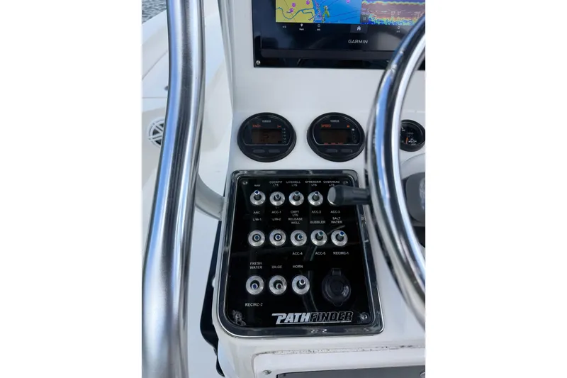 Slide: The Image of Control panel of a 2012 Pathfinder 2200 TRS boat with Garmin display. - 18