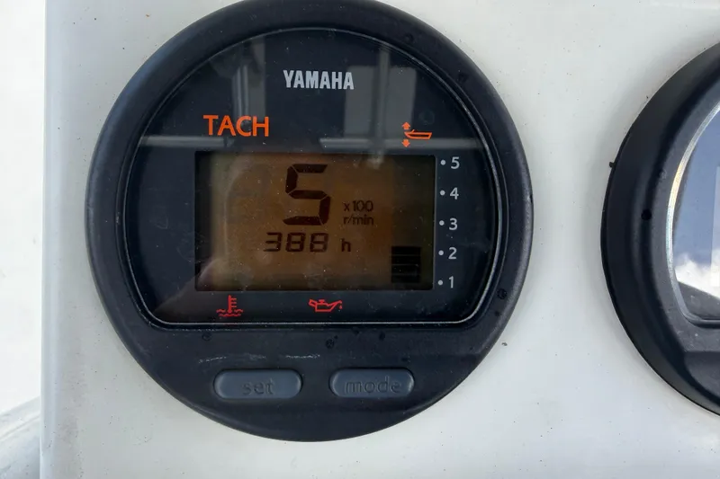 Slide: The Image of Yamaha tachometer displaying 388 hours on a 2012 Pathfinder 2200 TRS boat. - 20