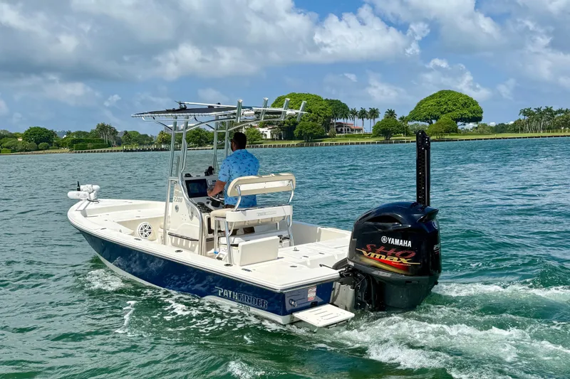 Slide: The Image of 2012 Pathfinder 2200 TRS boat cruising on a sunny day with Yamaha engine. - 4