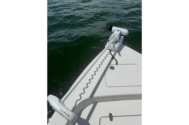 Slide: The Image of 2012 Pathfinder 2200 TRS boat with Minn Kota trolling motor on calm water. - 8