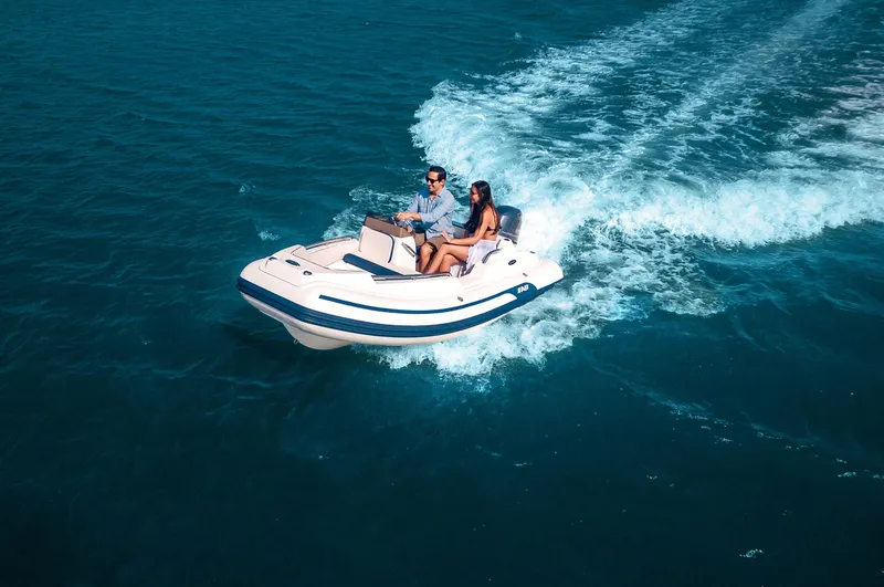 Slide: The Image of 2024 AB Inflatables Nautilus 13 DLX cruising on open water. - 7