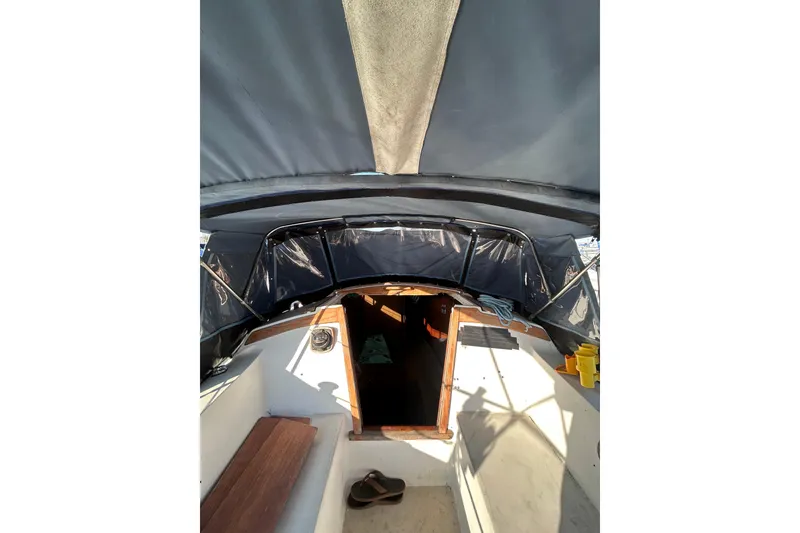 Slide: The Image of Interior view of a 1981 Catalina 30 sailboat cockpit with canopy. - 5