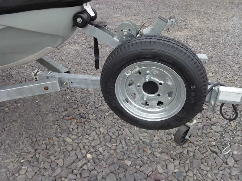 Slide: The Image of Trailer for Sea-Doo FishPro Sport 170 on gravel surface. - 28