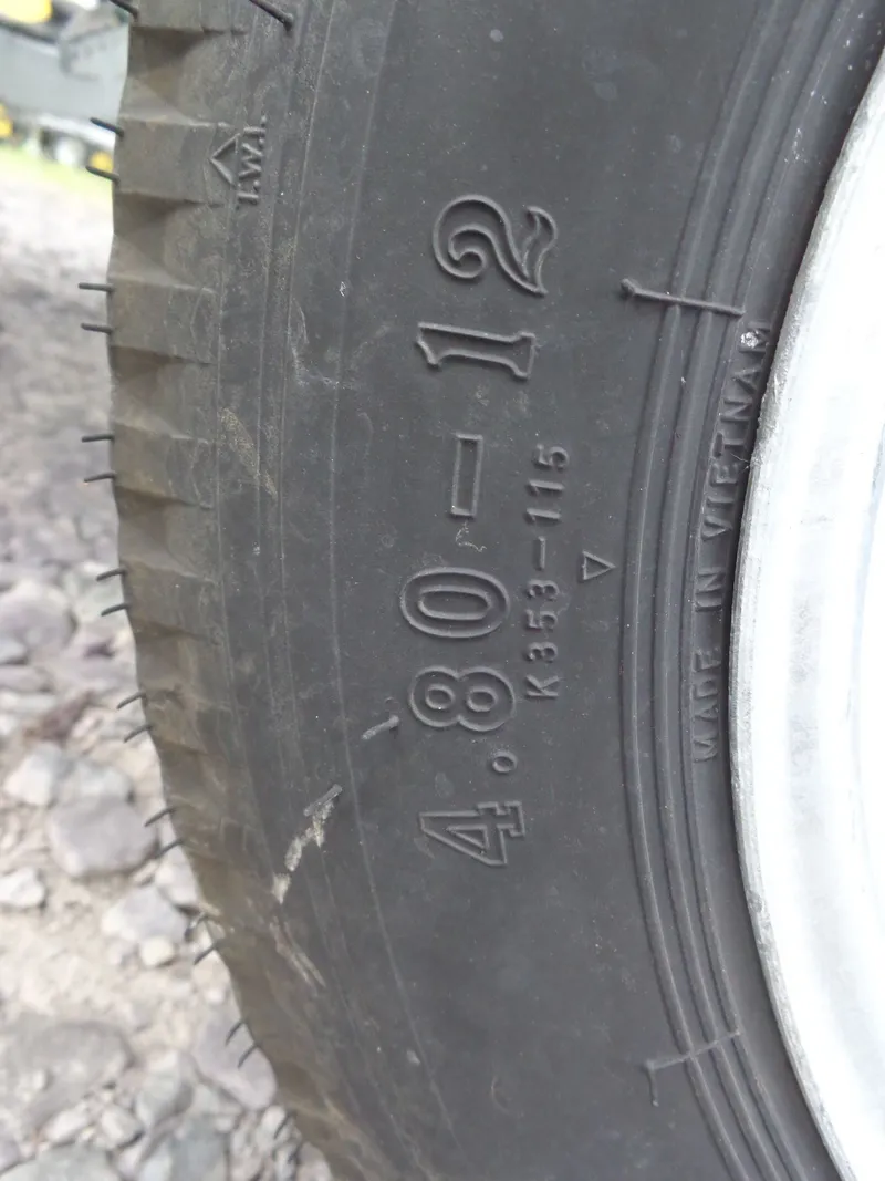 Slide: The Image of Close-up of a tire marked 4.80-12, made in Vietnam. - 36