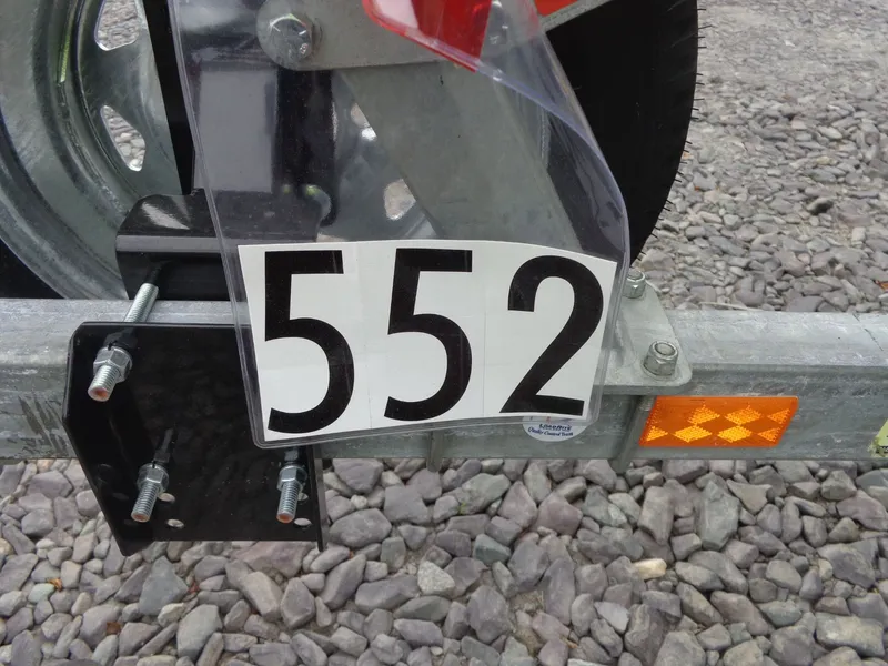 Slide: The Image of Trailer with number 552 and reflective sticker. - 41