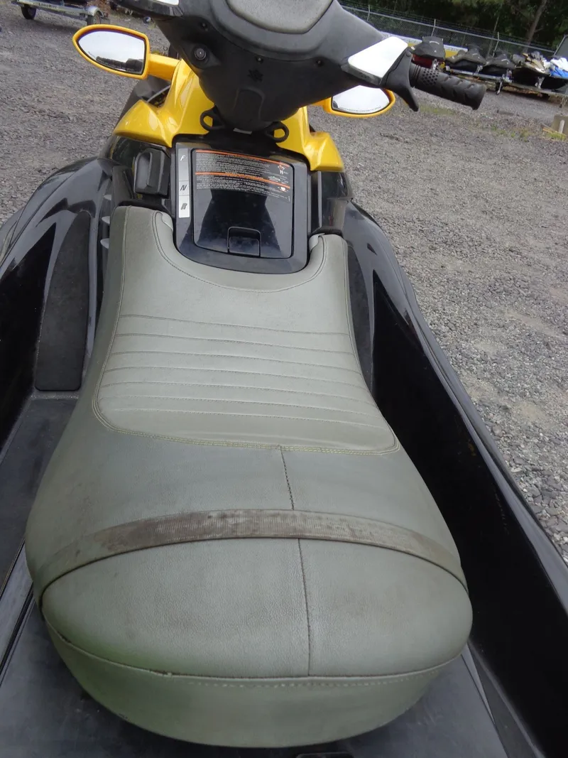 Slide: The Image of 2007 Sea-Doo RXT™ jet ski with gray seat on gravel surface. - 10