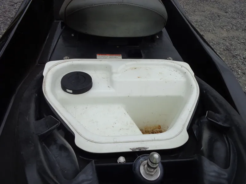 Slide: The Image of 2007 Sea-Doo RXT™ storage compartment, open, with seat in background. - 14