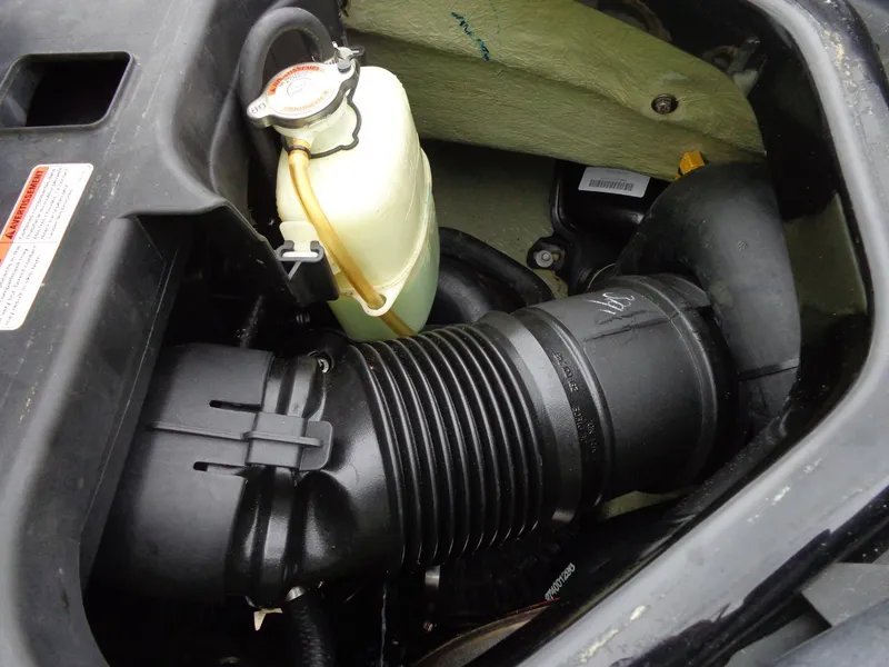 Slide: The Image of Engine compartment of a 2007 Sea-Doo RXT™ with coolant reservoir. - 15