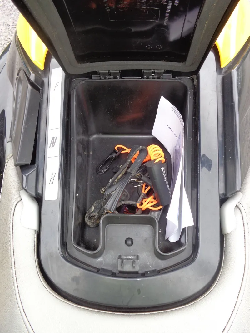 Slide: The Image of Storage compartment of 2007 Sea-Doo RXT with accessories and papers. - 21