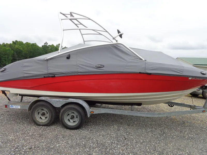 The Image of 2008 Yamaha AR210 boat with gray cover on trailer. - 1