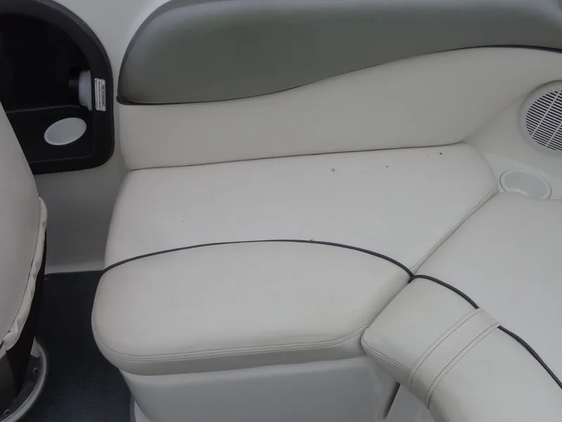 Slide: The Image of Interior of a 2008 Yamaha AR210 boat with beige upholstery. - 14