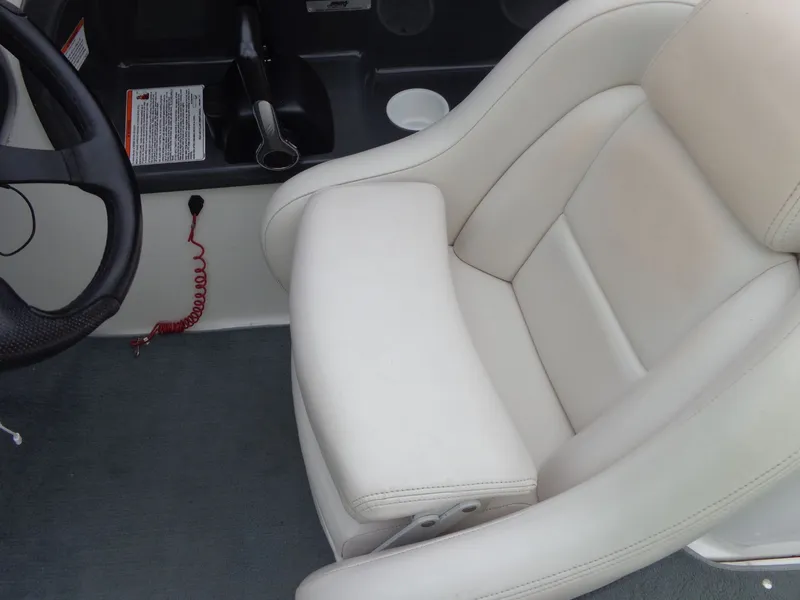 Slide: The Image of Interior of a 2008 Yamaha AR210 boat with white seating. - 18
