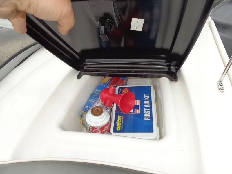 Slide: The Image of Yamaha AR210 boat storage compartment with first aid kit and accessories, year 2008. - 24