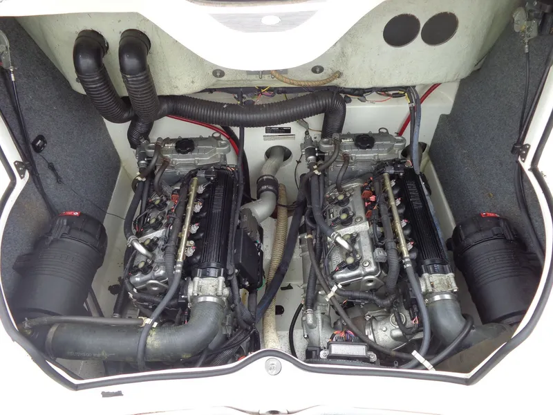 Slide: The Image of Engine compartment of a 2008 Yamaha AR210 boat with dual engines. - 27
