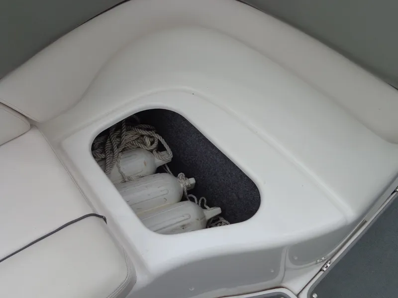 Slide: The Image of 2008 Yamaha AR210 boat storage compartment with fenders. - 29
