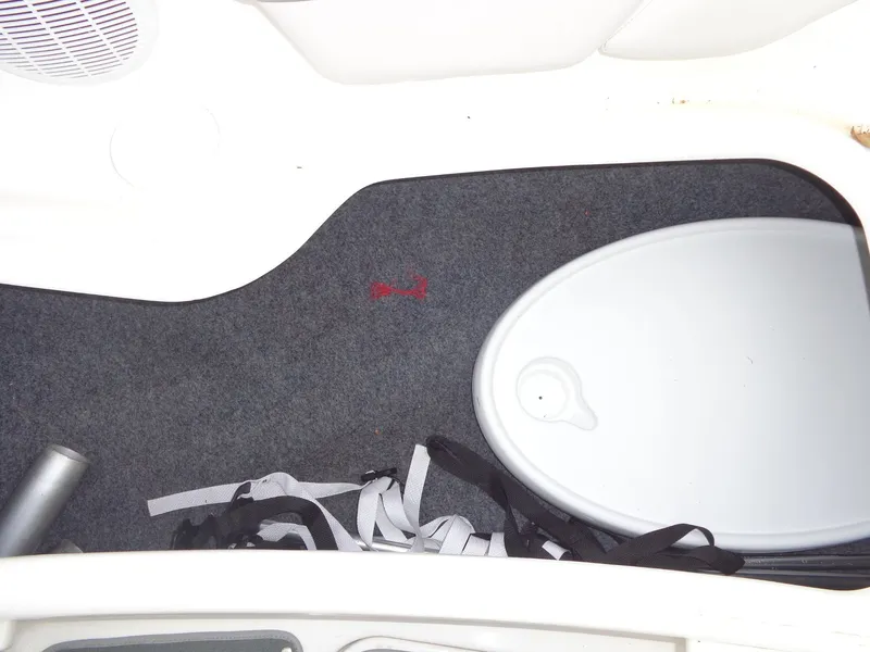 Slide: The Image of Interior of a 2008 Yamaha AR210 boat with carpet and accessories. - 35