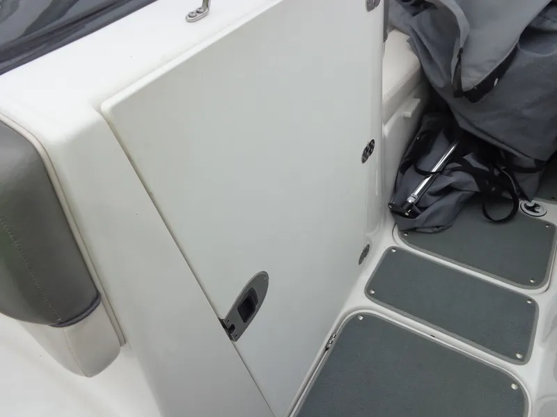 Slide: The Image of Interior of a 2008 Yamaha AR210 boat with storage compartment. - 36