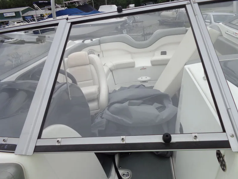 Slide: The Image of Interior of a 2008 Yamaha AR210 boat with white seating. - 41