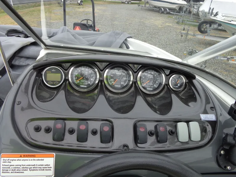 Slide: The Image of Dashboard of a 2008 Yamaha AR210 boat with gauges. - 45