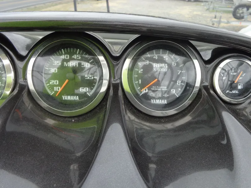 Slide: The Image of Dashboard of a 2008 Yamaha AR210 boat with speedometer and tachometer. - 47
