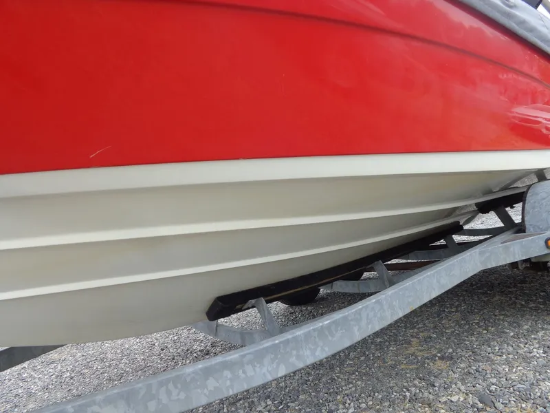 Slide: The Image of Red Yamaha AR210 boat hull on trailer, year 2008. - 6