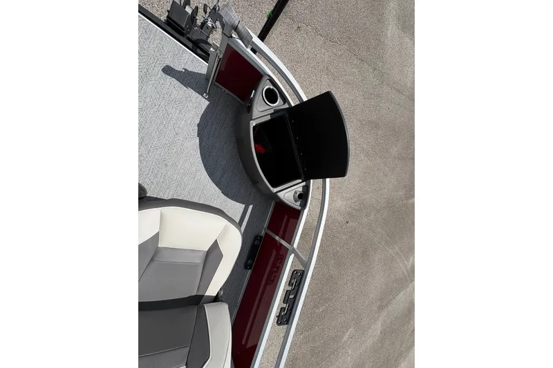 Slide: The Image of 2026 Sun Tracker Bass Buggy 18 DLX boat interior with seating and console. - 13