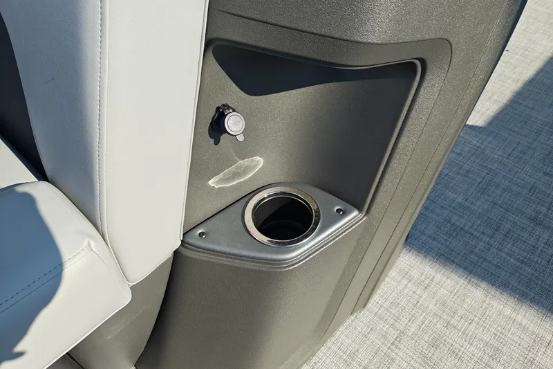 Slide: The Image of 2026 Sun Tracker Party Barge 20 DLX cup holder and seating detail. - 19