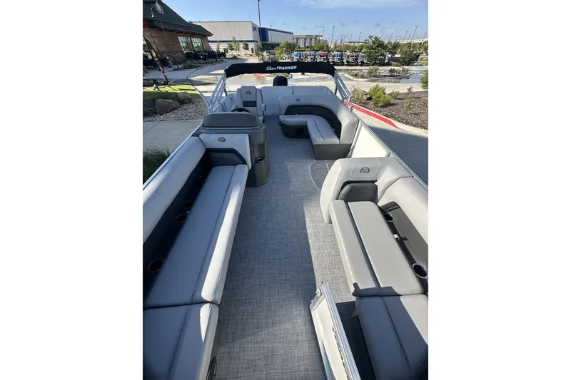 Slide: The Image of 2026 Sun Tracker Party Barge 16 DLX interior with spacious seating and modern design. - 12