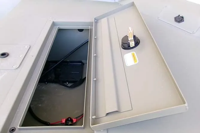 Slide: The Image of Open storage compartment on 2026 Tracker Grizzly 1648 SC boat, showcasing interior details. - 8