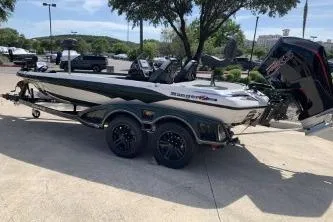 Slide: The Image of 2026 Ranger Z519R boat on trailer, parked outdoors under clear sky. - 7