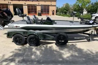 Slide: The Image of 2026 Ranger Z519R boat on trailer, parked outdoors in sunny setting. - 1