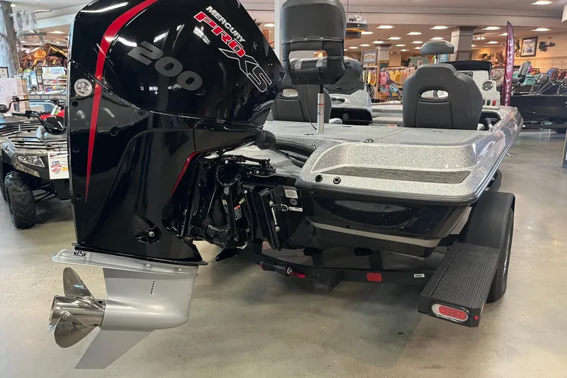 Slide: The Image of 2026 Nitro Z19 XL boat with Mercury Pro XS 200 engine in showroom. - 6