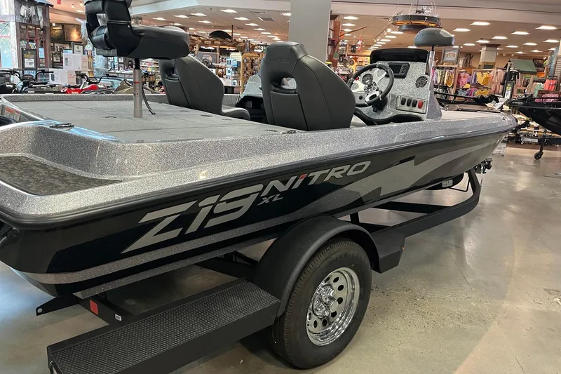 Slide: The Image of 2026 Nitro Z19 XL boat displayed indoors, showcasing sleek design and modern features. - 5