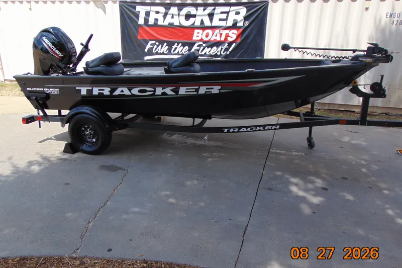 The Image of 2026 Tracker Super Guide V-16 T boat on trailer, displayed outdoors. - 0