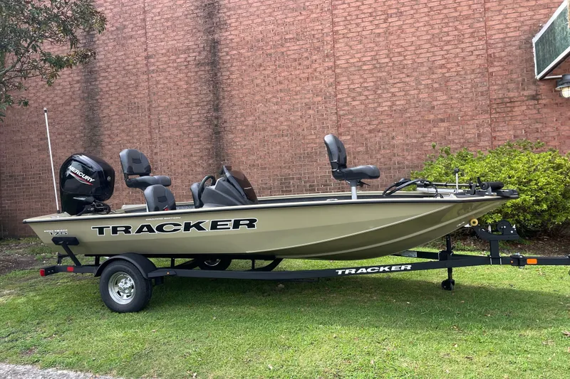 The Image of 2026 Tracker Pro Team 175 Crappie Edition boat on trailer, parked on grass. - 0